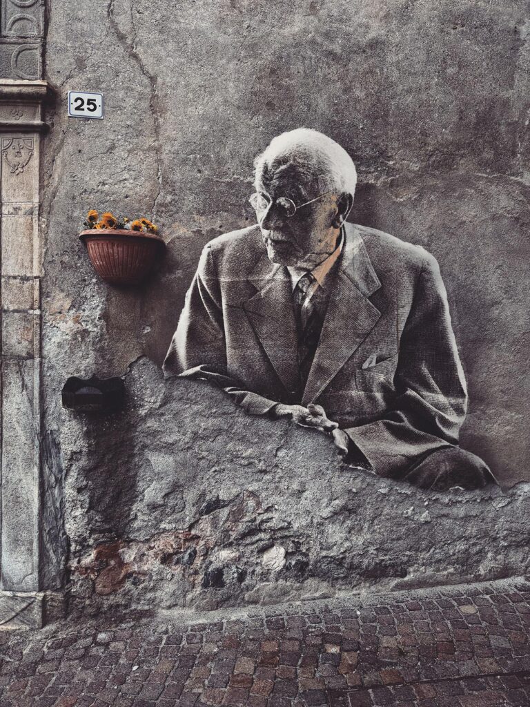 Carl Gustav Jung May 2025 by Street Artist Beast. Carl Gustav Jung emerging from a weathered wall, where psychological depth meets architectural erosion.