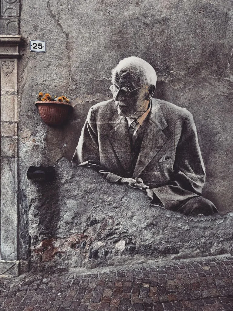 Carl Gustav Jung May 2025 by Street Artist Beast. Carl Gustav Jung emerging from a weathered wall, where psychological depth meets architectural erosion.