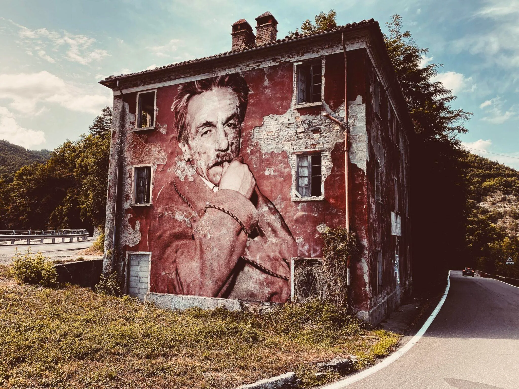 Eduardo De Filippo July 2023 by Street Artist Beast. Eduardo De Filippo embedded in the texture of an abandoned wall, a presence rooted in cultural memory and neglected places.