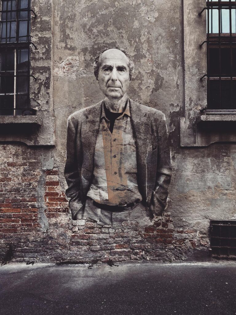 Philip Roth August 2025 by Street Artist Beast. Philip Roth emerging from decay, confronting the viewer with history, complexity, and persistence.