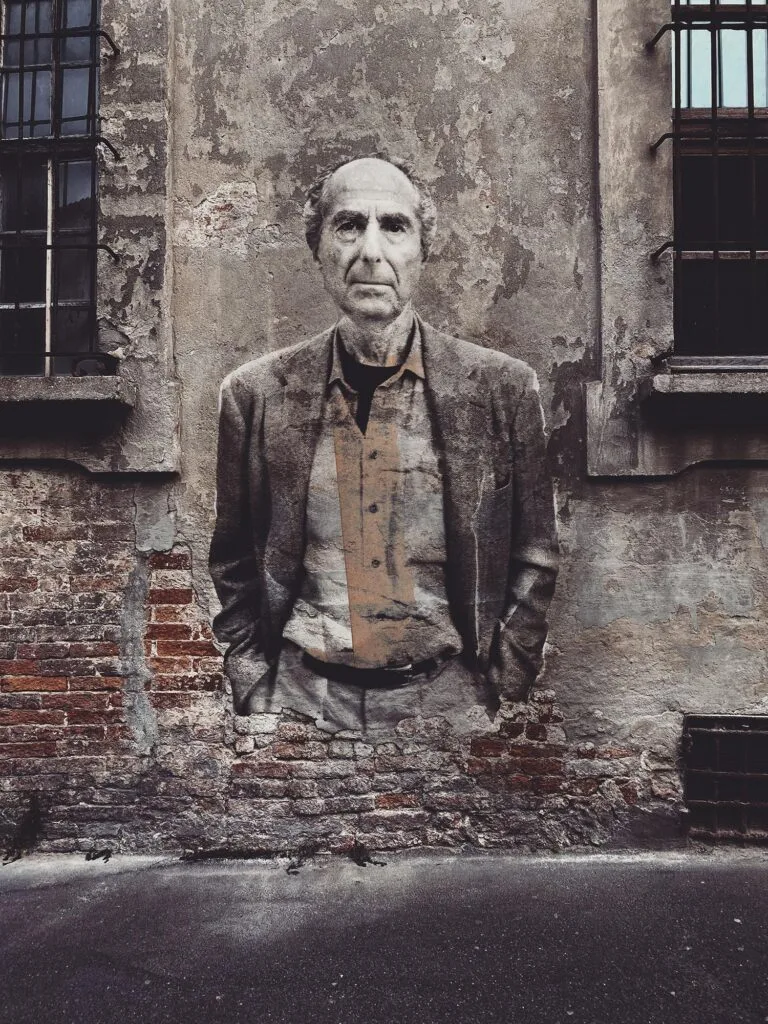 Philip Roth August 2025 by Street Artist Beast. Philip Roth emerging from decay, confronting the viewer with history, complexity, and persistence.