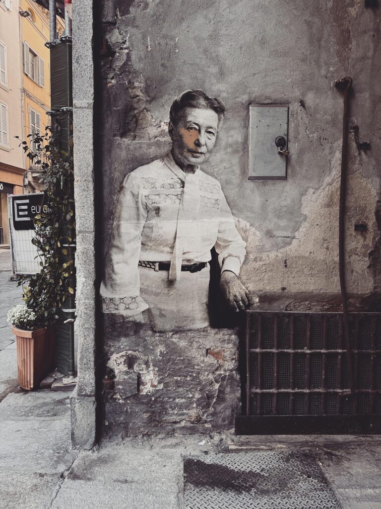 Simone De Beauvoir April 2025 by Street Artist Beast. Simone de Beauvoir revealed through erosion, a symbol of intellectual resistance and lasting thought.